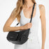 Cartera Michael Kors de hombro Merritt convertible mediano de piel granulada