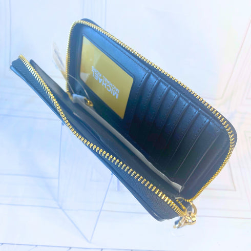 Billetera y cartera de mano Michael Kors modelo Jet Set