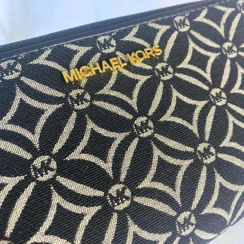 Billetera y cartera de mano Michael Kors modelo Jet Set