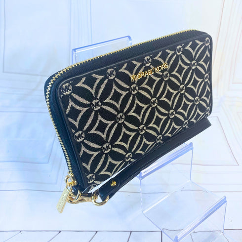 Billetera y cartera de mano Michael Kors modelo Jet Set