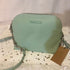 Crossbody Steve Madden BMaggie oval con cadena verde agua