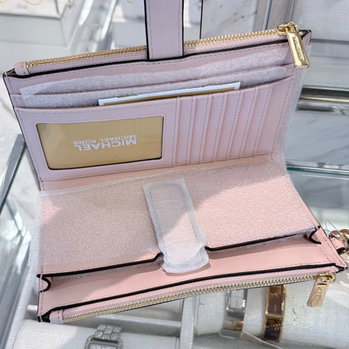 Cartera de mano y billetera Michael Kors Jet Set porta telefono logo monograma rosa