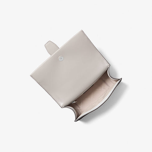 Cartera Michael Kors Greenwich Small Signature Logo blanco y gris