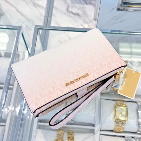 Cartera de mano y billetera Michael Kors Jet Set porta telefono logo monograma rosa